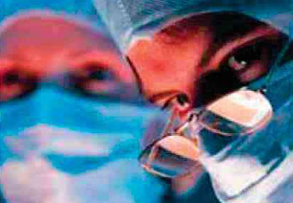 A surgeon is holding a glass of water.